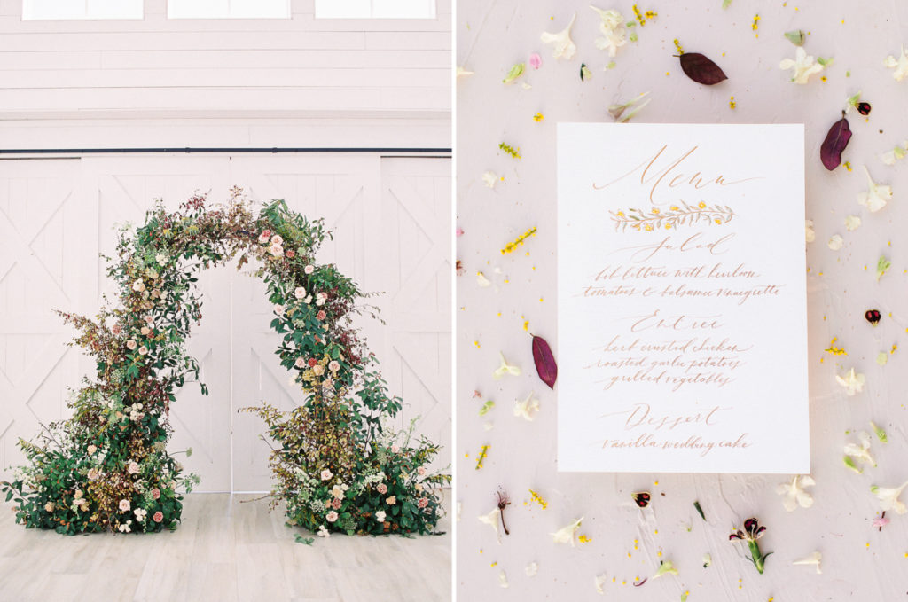 Wedding ceremony organic floral arch and hand-lettered wedding menu
